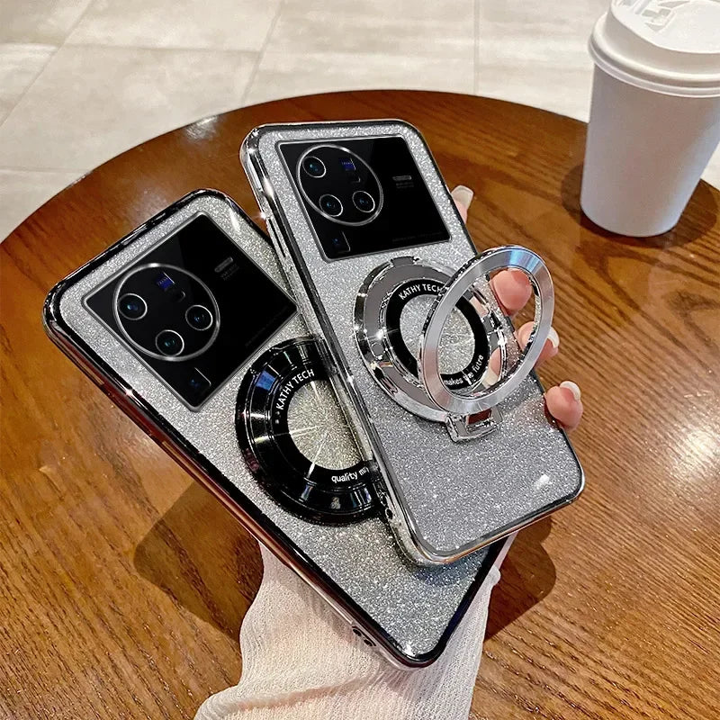 Glittery silver phone cases with ring holders and camera cutouts.