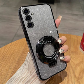 Glittery silver smartphone with a black circular attachment and triple rear cameras.