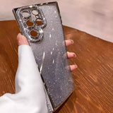 Glittery silver smartphone case with a diamond-encrusted camera lens protector.