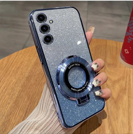 Glittery silver smartphone with three cameras and a circular magnetic attachment on the back.