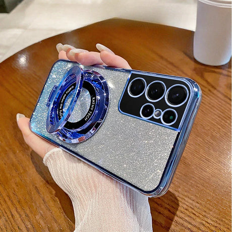 Glittery smartphone case with a blue ring accessory and multiple camera lenses.