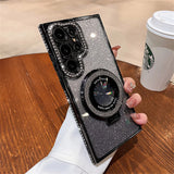 Glittery smartphone case with a prominent circular design and multiple camera lenses.