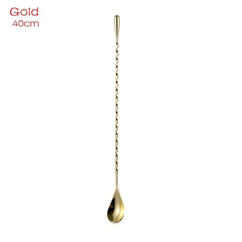 a gold spoon with a long handle