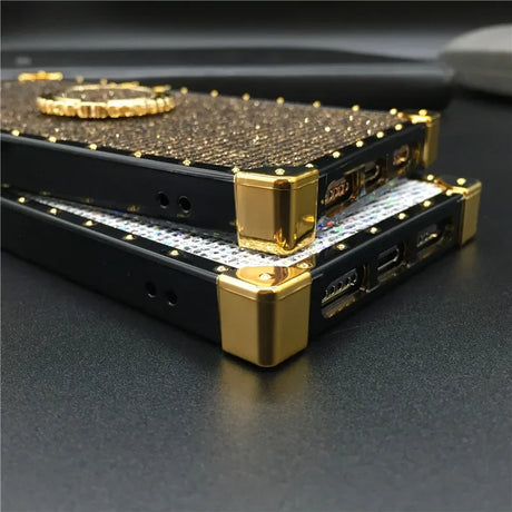 Gold-accented electronic device with a textured surface and multiple ports.