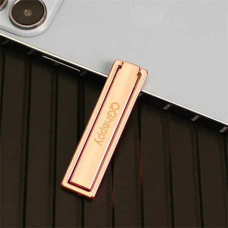 a gold bar on a black surface