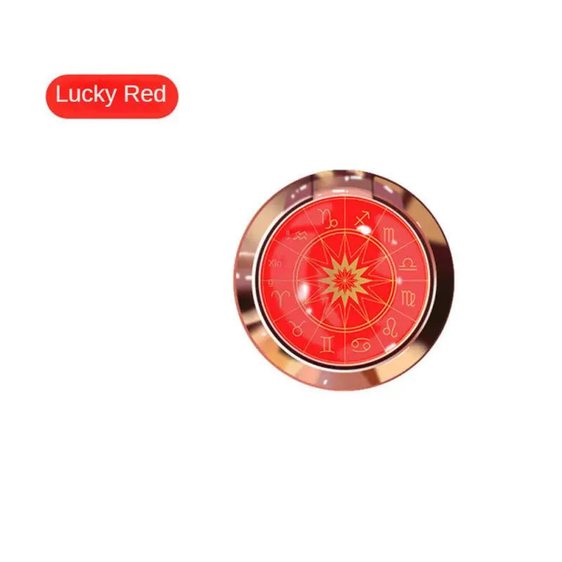 a red and gold colored button with a star on it