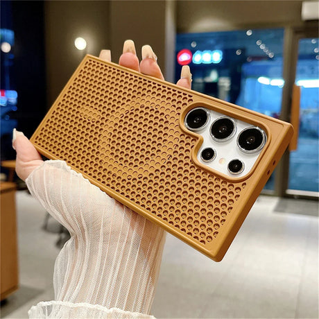 Gold-colored perforated phone case with multiple camera cutouts.