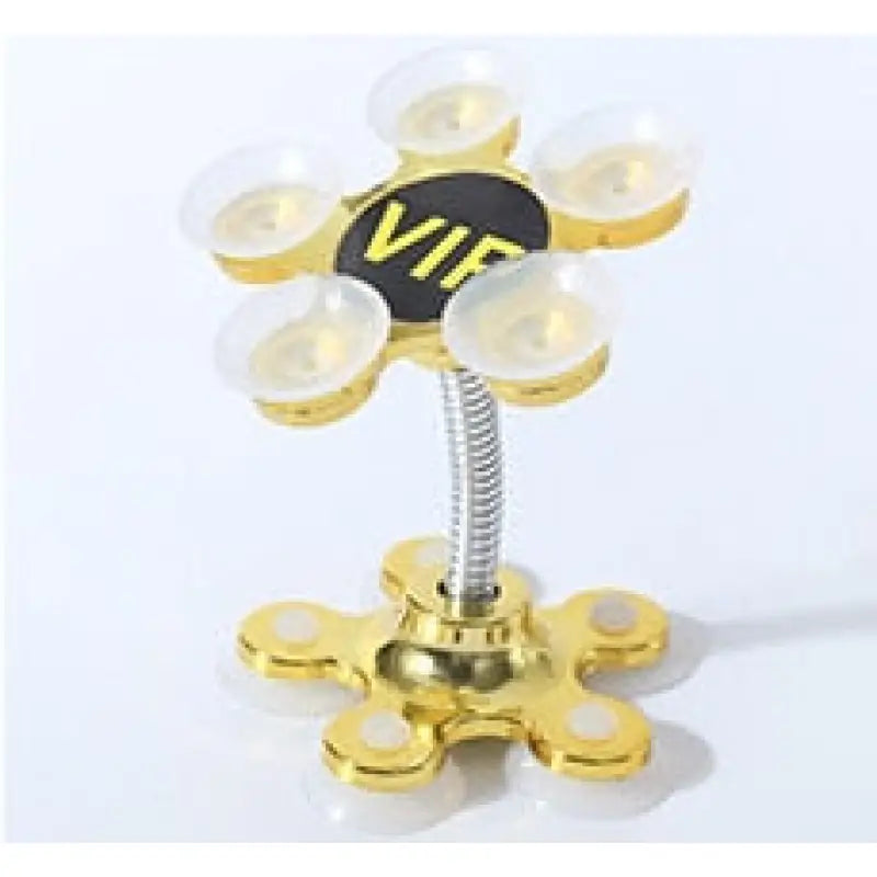 a gold metal flower with a black and white letter v
