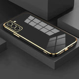 the gold iphone case is shown on a black surface