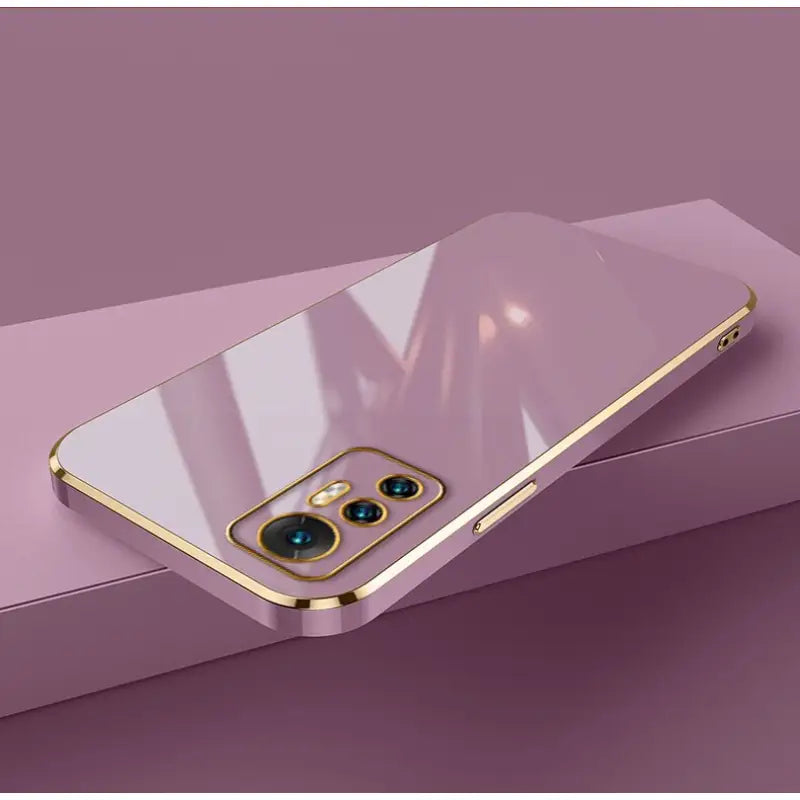a gold iphone case with a blue eye