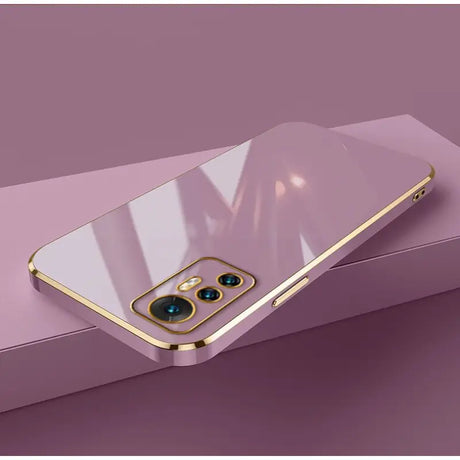 A gold iphone case with a blue eye