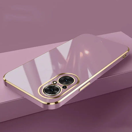 a gold iphone case with a camera lens