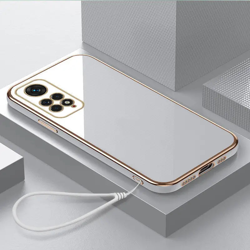 a gold iphone case with a charging cable