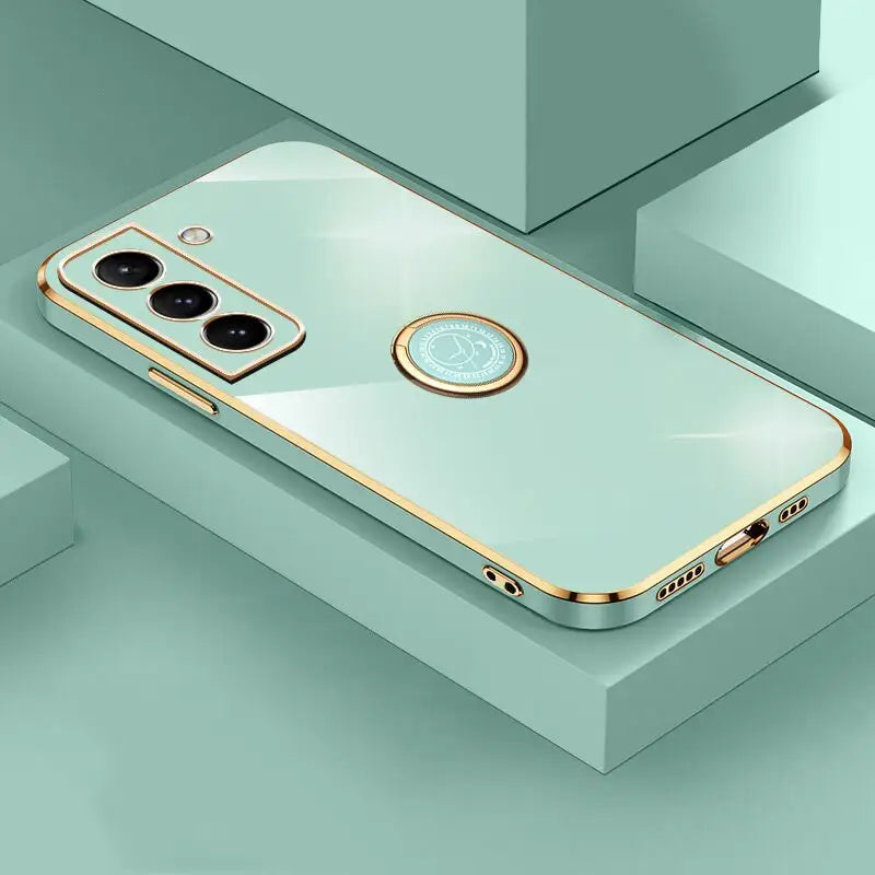 the back of a gold iphone case with a circular mirror