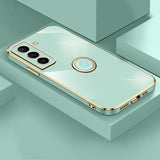 the back of a gold iphone case with a circular mirror