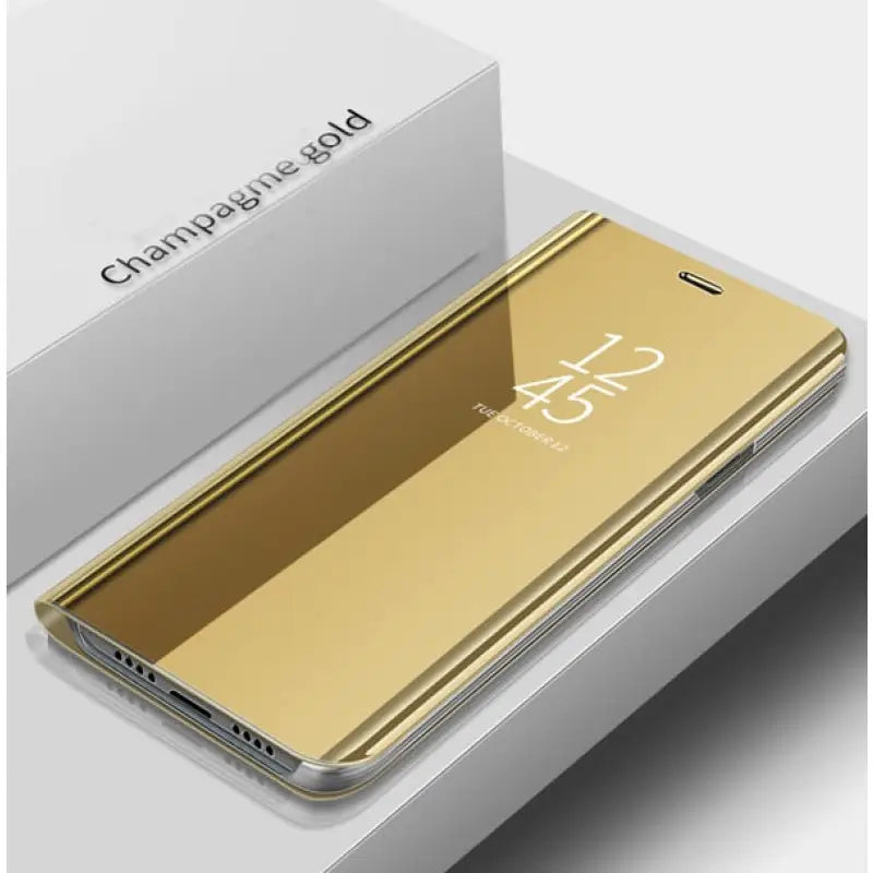 the gold iphone case is shown in the box