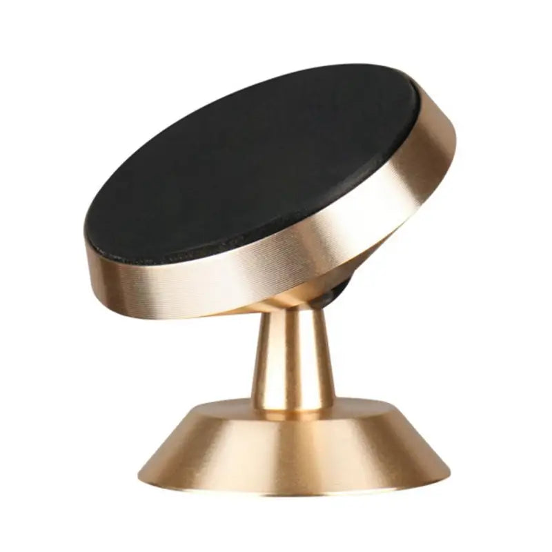 a gold and black knob on a white background