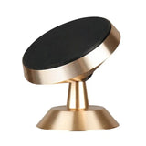 a gold and black knob on a white background