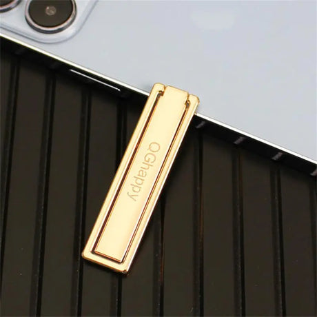 a gold metal case with a metal bar on it