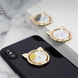 a gold phone holder with a watch on it