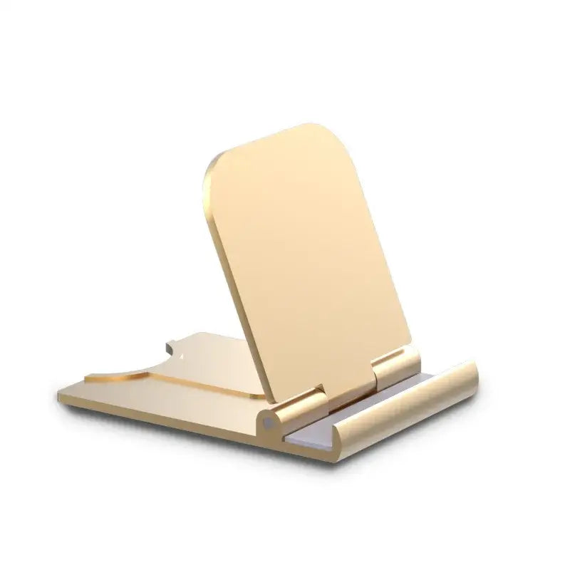 A gold phone stand with a white background