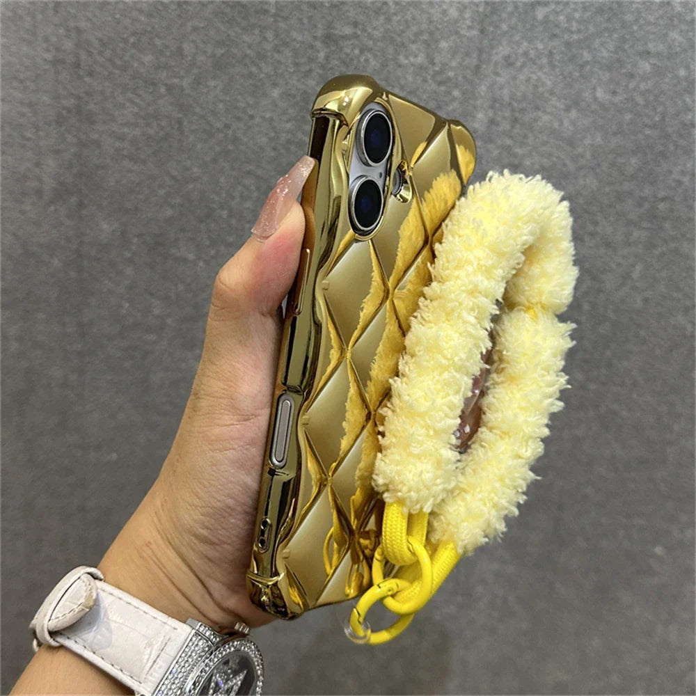 Gold quilted phone case with fuzzy yellow strap.