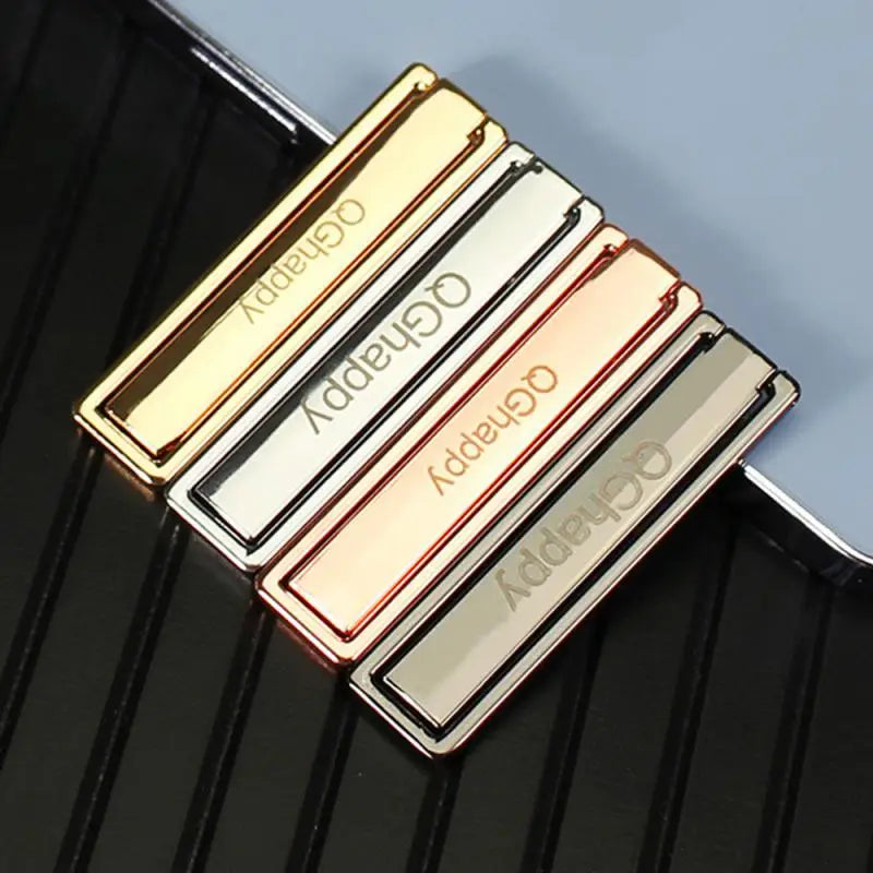 a gold and silver money clip with the word good on it