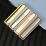 a gold and silver money clip with the word good on it