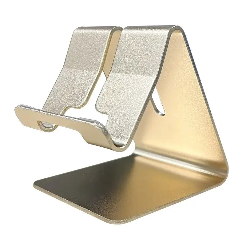 a gold and silver phone stand