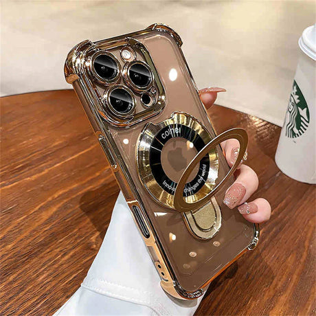 Gold-trimmed clear phone case with ring stand.