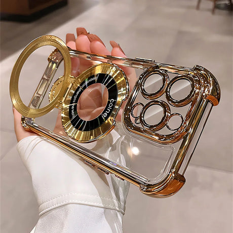 Gold-trimmed clear phone case with ring stand.