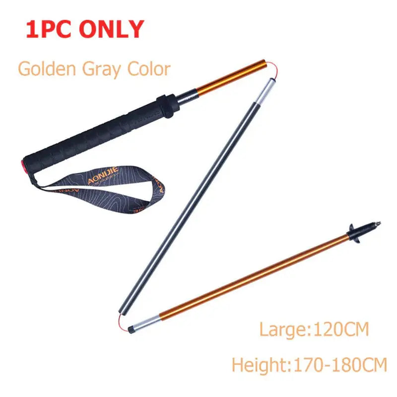 a pair of gold and silver metal detector with a black and orange handle