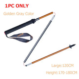 a pair of gold and silver metal detector with a black and orange handle