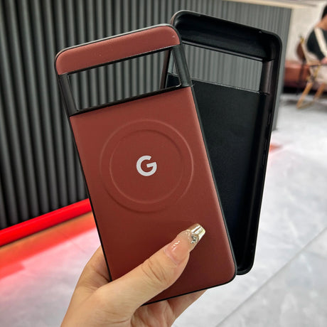 Google-branded portable battery pack or power bank in a reddish-brown color.