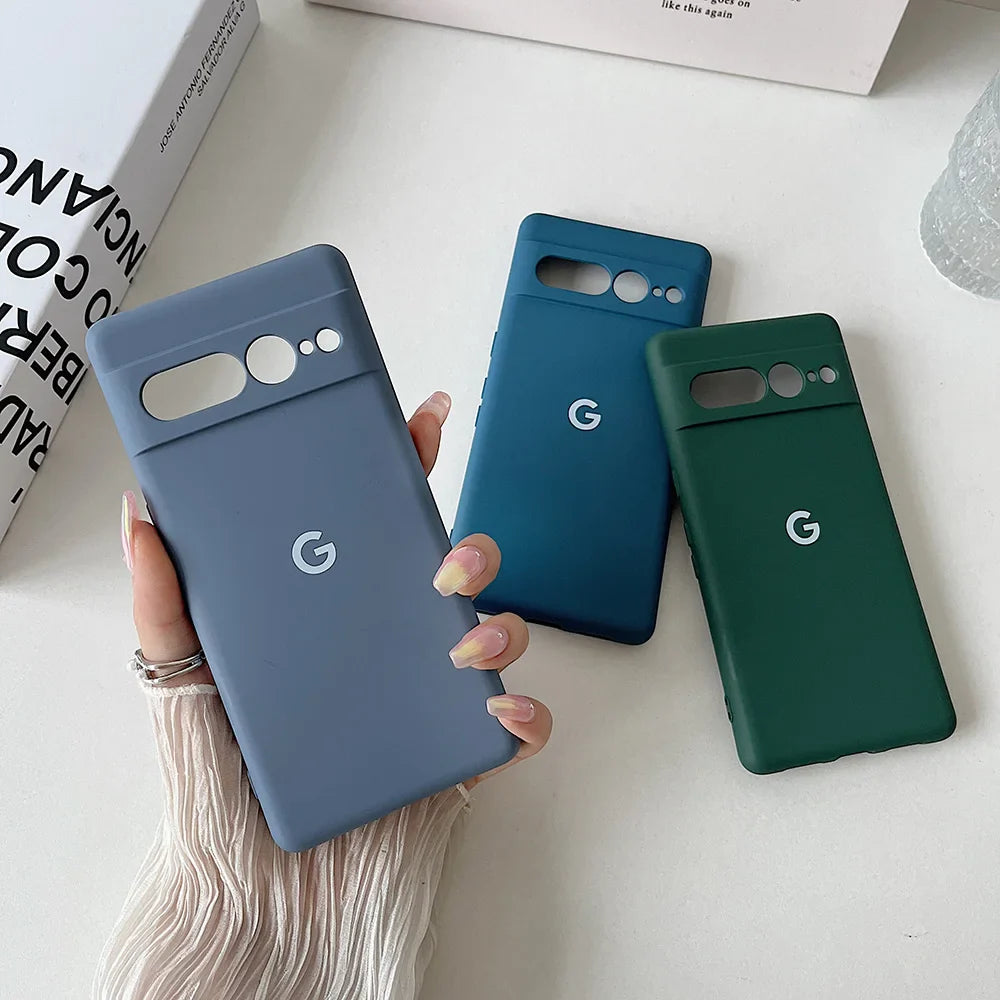 Google Pixel smartphone cases in gray, blue, and green colors.