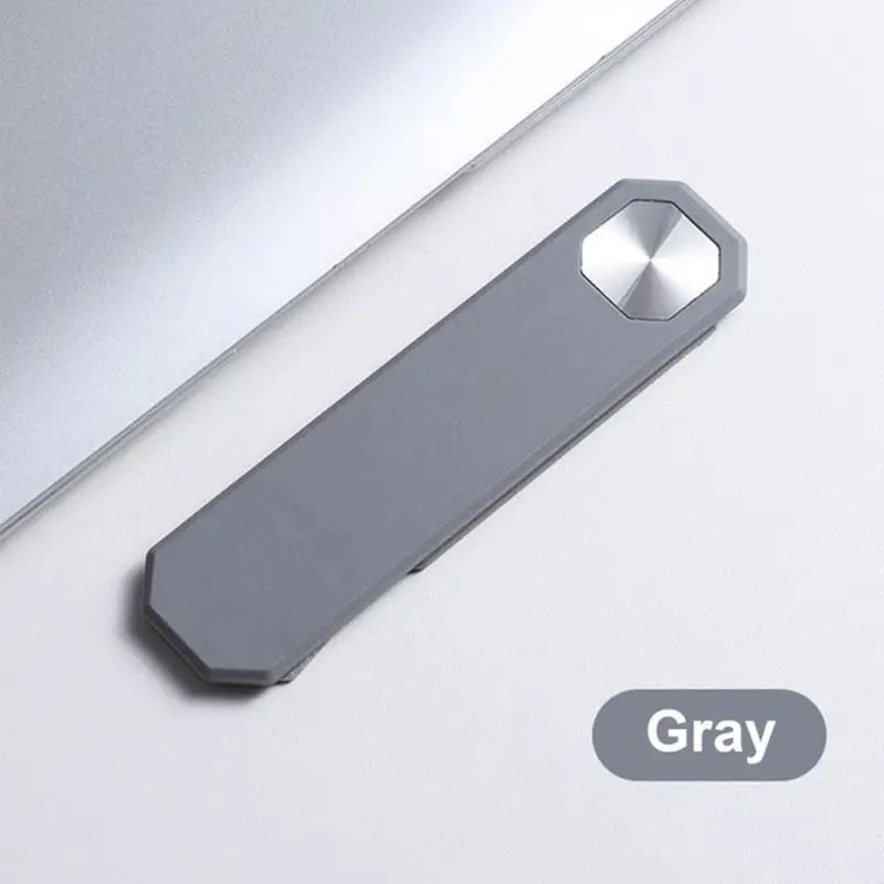 a gray usb stick sitting on top of a laptop