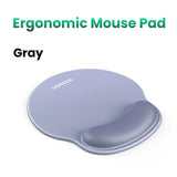 Gray ergonomic mouse pad with a wrist rest.