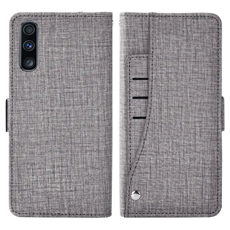 The back of a gray iphone case with a card slot