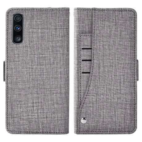 The back of a gray iphone case with a card slot