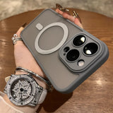 Gray iPhone case with a circular MagSafe ring and triple camera cutout.