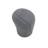 a gray plastic knob with a white background