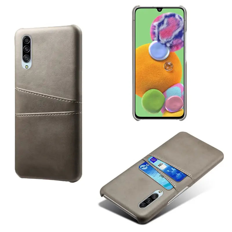 the back and front view of a grey leather case with a phone in the back