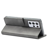 The back of a gray leather case with a white phone