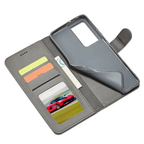 The back of a gray leather wallet case with a credit card slot