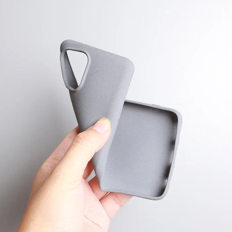 Gray silicone phone case with a triangular cutout handle.