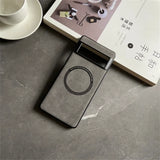 Gray smartphone case with a circular cutout, likely for wireless charging.