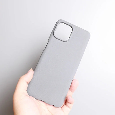 Gray smartphone case held in a hand.