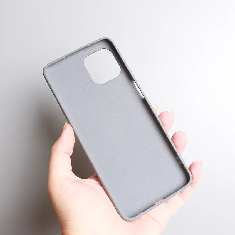 Gray smartphone case held in a hand.