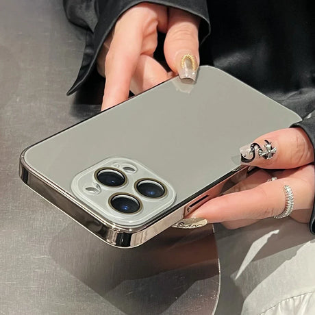 A gray smartphone with a shiny silver bumper case.