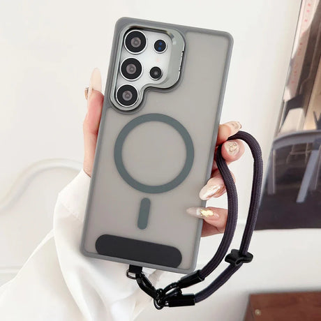 A gray translucent phone case with a visible magnetic ring and a black wrist strap.